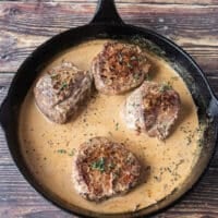 Cream is added after the sauce has simmered and reduced for the final creamy finish of the peppercorn steak sauce