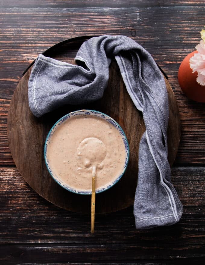 A bowl of taco sauce surrounded by a tea towel 