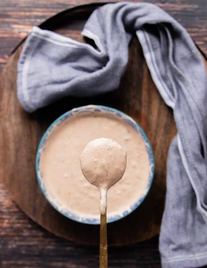 A spoonful of a creamy taco sauce 