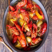 Perfectly cooked large pot of crawfish boil ready to drain and serve