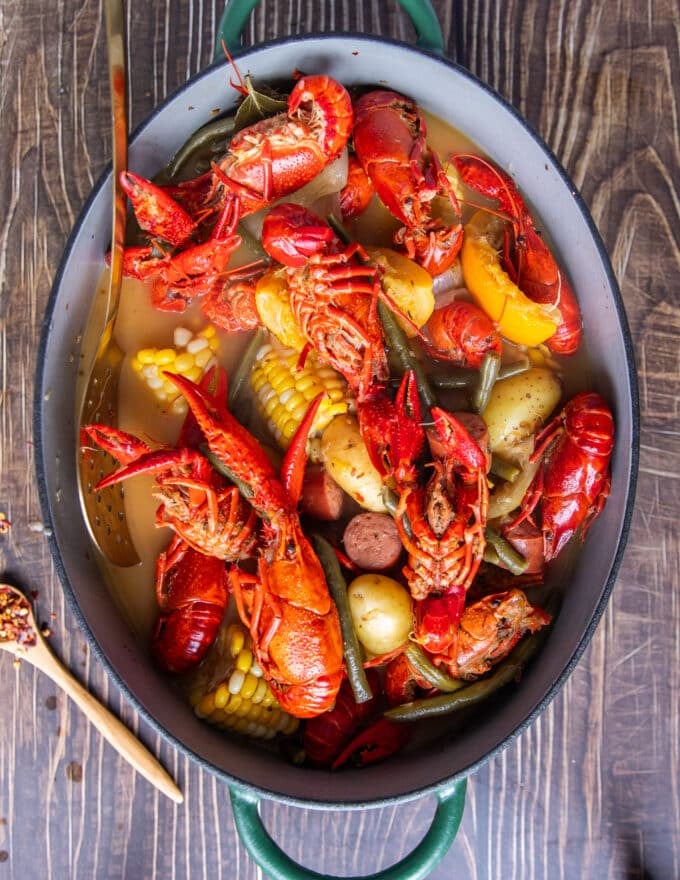 Perfectly cooked large pot of crawfish boil ready to drain and serve 