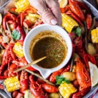 cajun melted butter added on top of the crawfish boil at serving