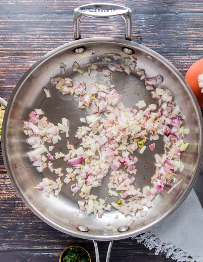 cooking onions and garlic in oil to start the black beans 