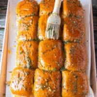 A brush used to brush the melted garlic herb butter over the tops of the slider bread evenly before baking