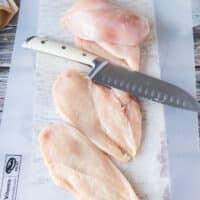 chicken breasts sliced in half to cook