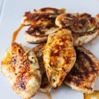 chicken cooked and removed on a to board to cool down