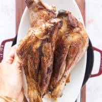 browned lamb shanks removed on to a plate to make the liquid base for slow cooking