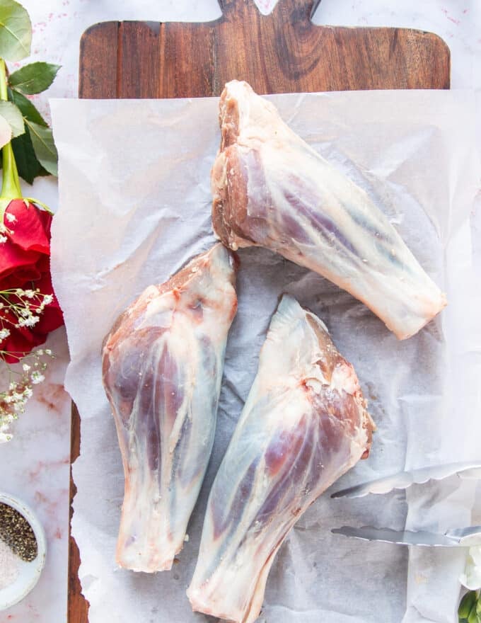 Lamb shanks on a cooking board
