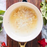 butter and garlic are sautéed in a saucepan to start the sauce