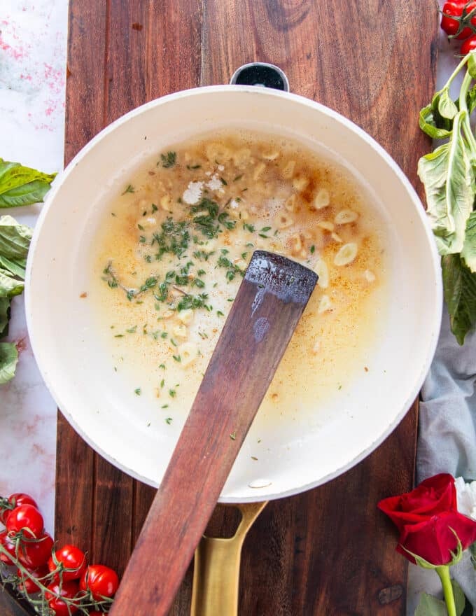 flour and thyme are added to start building the sauce