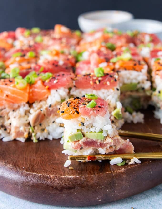 One close up slice of sushi cake showing the layers