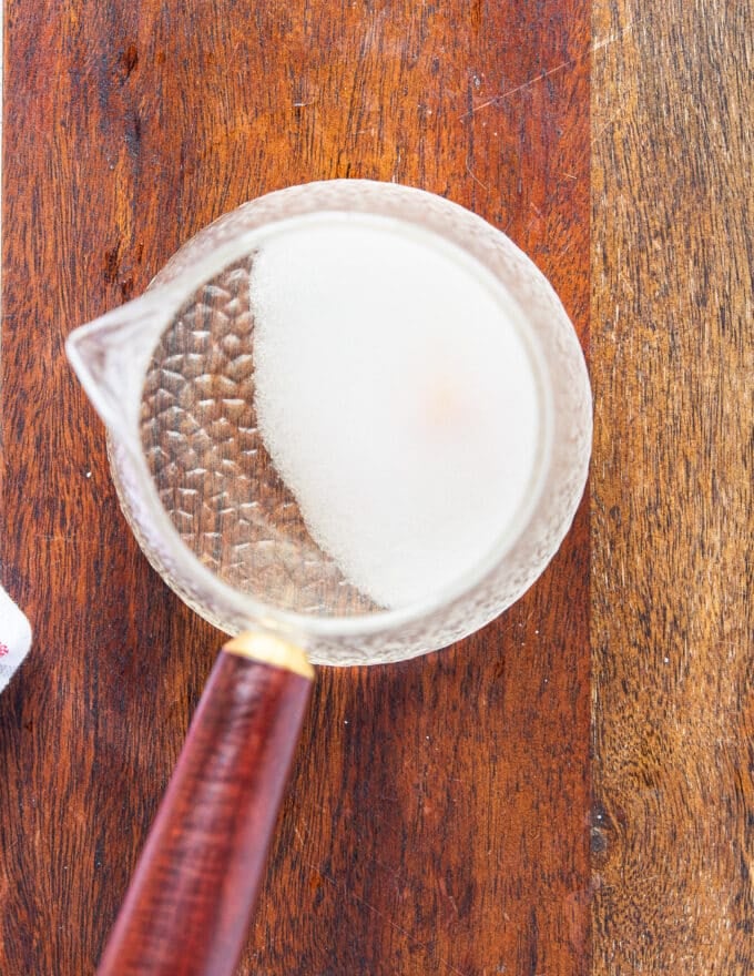 rice seasoning ingredients are all added into a small pot to warm up and dissolve the sugar and salt in the vinegar