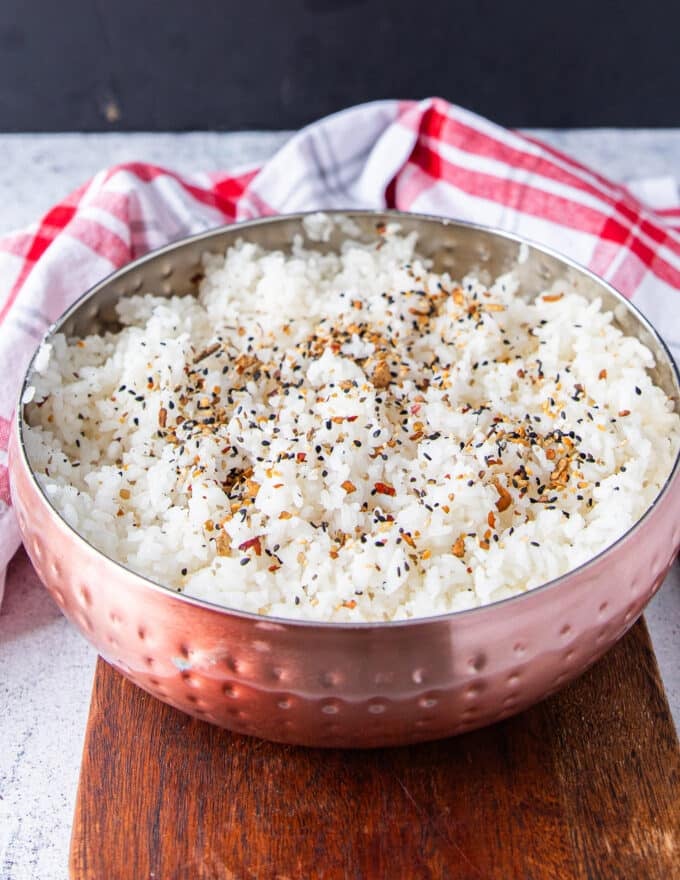 seasoned and cooked fluffy sushi rice in a large bowl cooled and ready to use