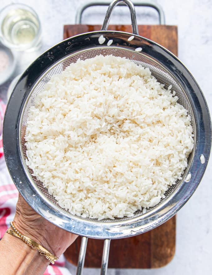 Perfectly rinsed and soaked short grain rice in a sieve