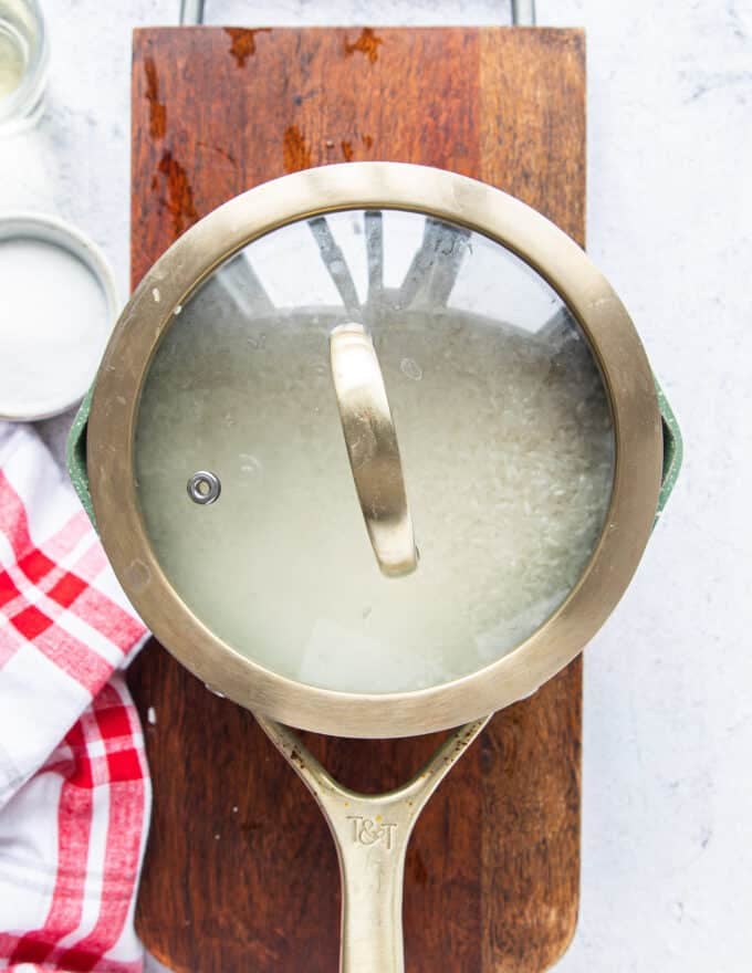 covered pot of sushi rice to finish steaming