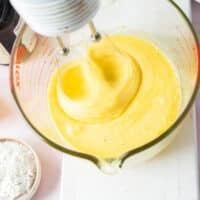 Initial beating of the sugar and eggs and incorporating air into the brownie pudding