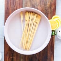 wooden skewers soaking in water for the chicken spiedini