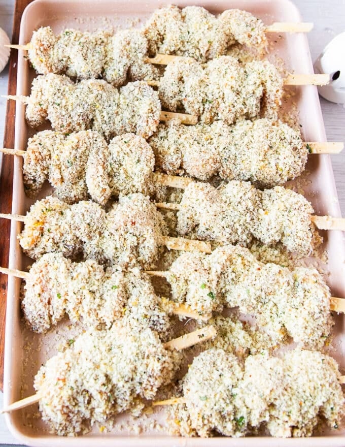 Chicken spiedini skewered on a baking tray and ready to cook