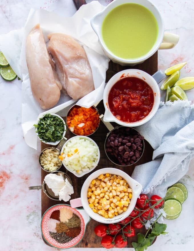 small bowls with the ingredients needed to make chicken taco soup