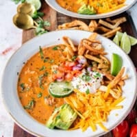 close up of a full bowl of chicken taco soup loaded with toppings and ready to eat