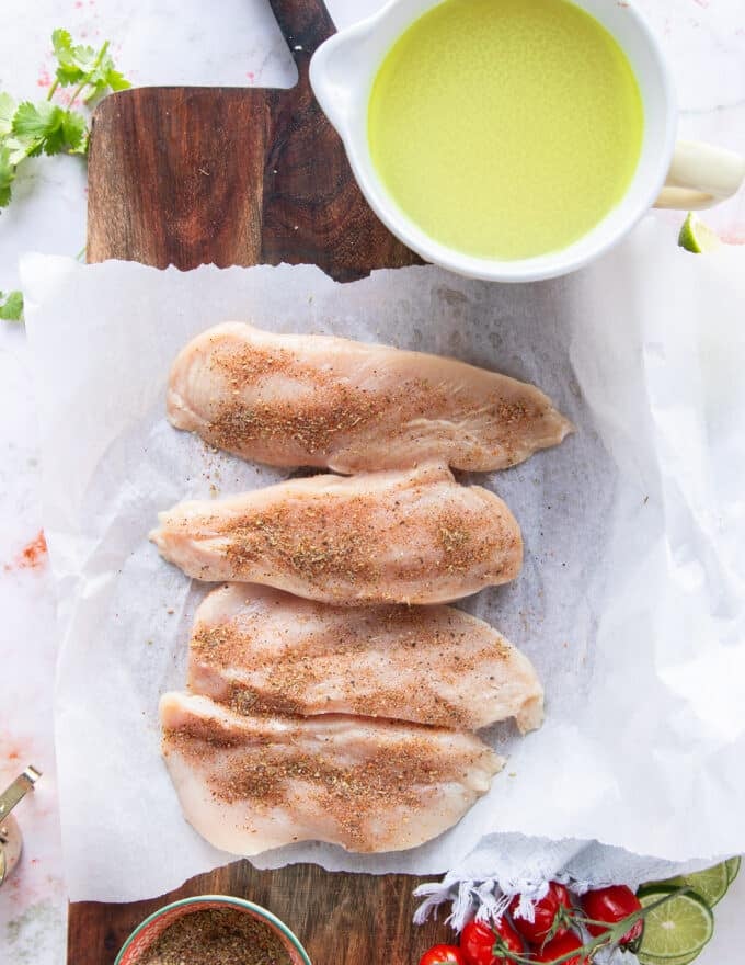 the chicken breasts are cut in half and seasoned to start the chicken taco soup from scratch