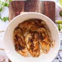 the seasoned chicken searing in a pot