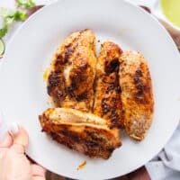 The seared chicken removed on to a separate plate