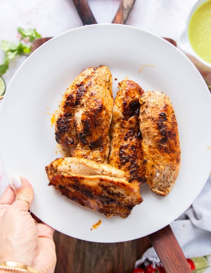 The seared chicken removed on to a separate plate