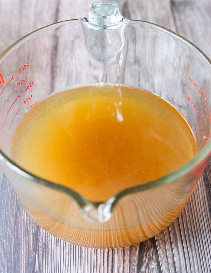 freshly strained crab stock still in the bowl