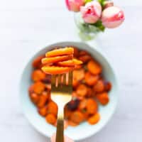 Fork showing a serving of golden maple glazed carrots perfectly cooked
