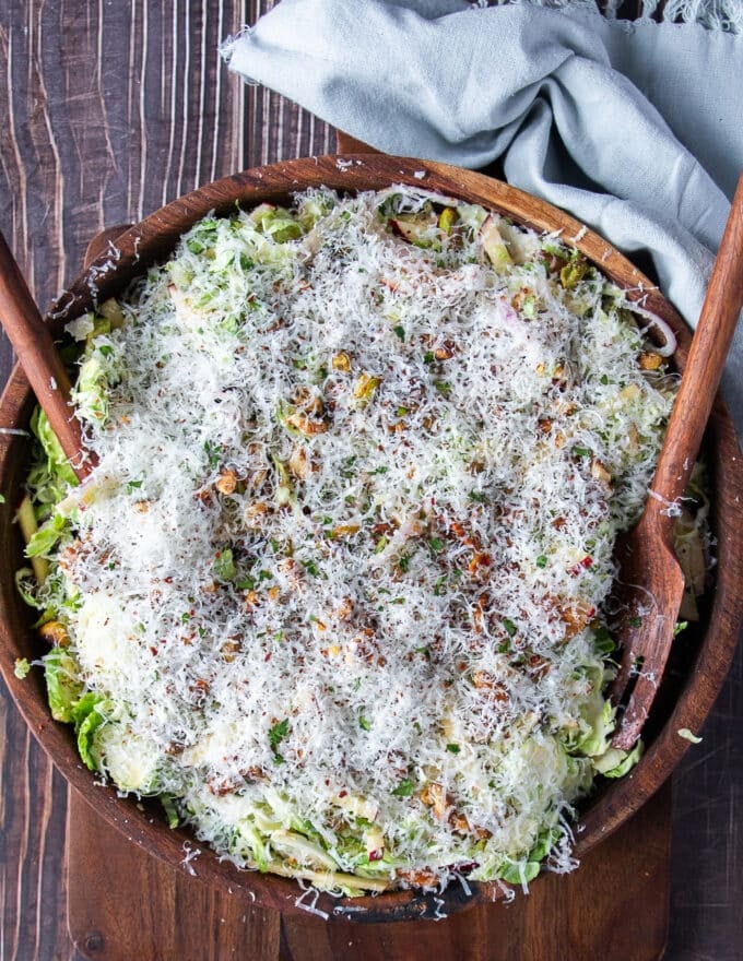 A final layer of freshly grated parmesan cheese is added over the salad