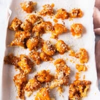 panko is sprinkled over the buffalo sauce coated baked cauliflower