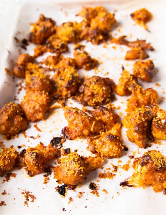 perfect crispy buffalo cauliflower out of the oven on a baking sheet