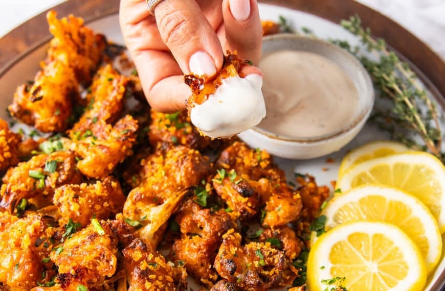 Buffalo cauliflower crispy and dipped and in ranch sauce
