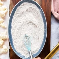 Flour is mixed with seasonings and spices