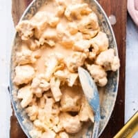 the cauliflower is tossed in the batter and coated evenly with the thick batter