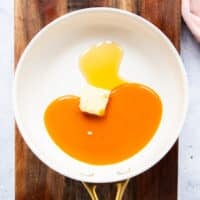 buffalo sauce, honey and butter in a skillet melting to form the buffalo coating