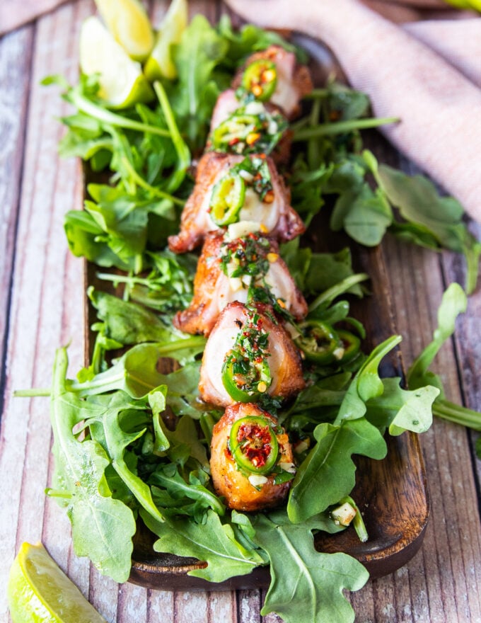 close up of a fried octopus piece close up showing the tender octopus and crispy coating