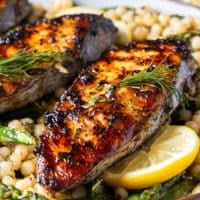 close up of king mackerel grilled to perfection showing the crisp skin and golden color