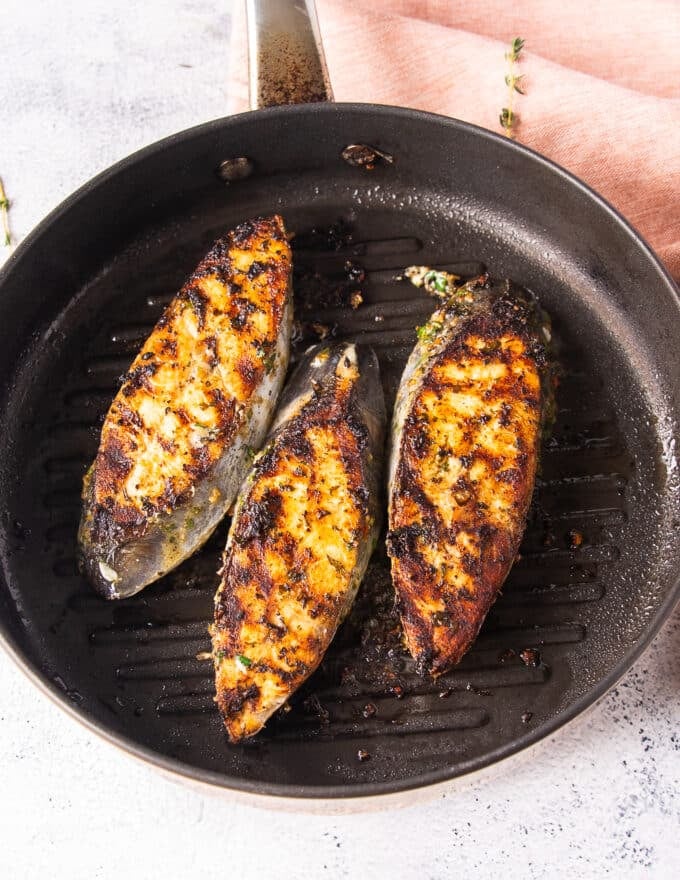 Perfect king mackerel steaks on the grill with crispy skin and brown grill marks