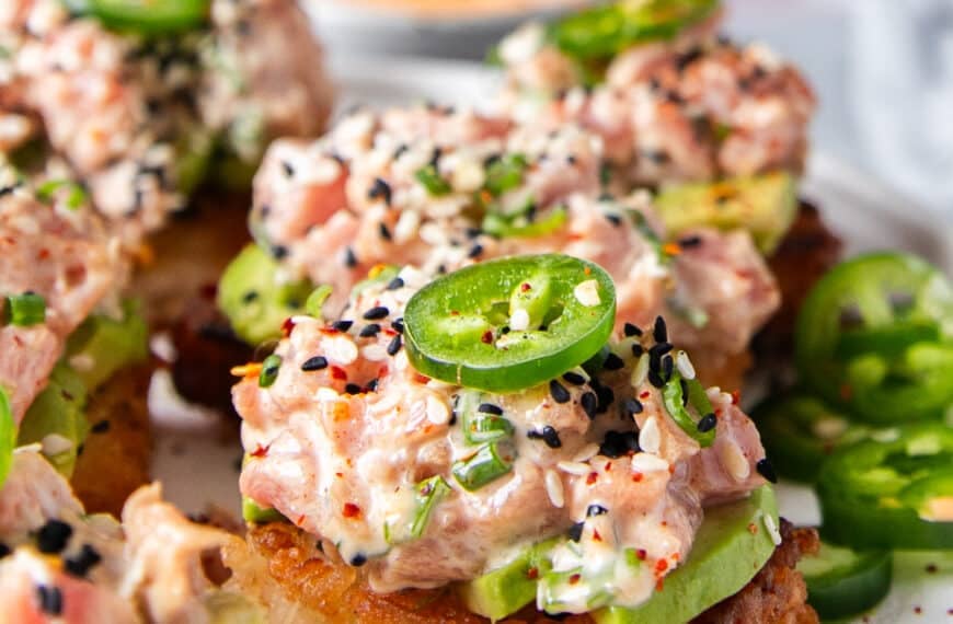 Spicy Tuna Crispy Rice topped with avocados and jalapenos, showing the crisp rice and creamy tuna