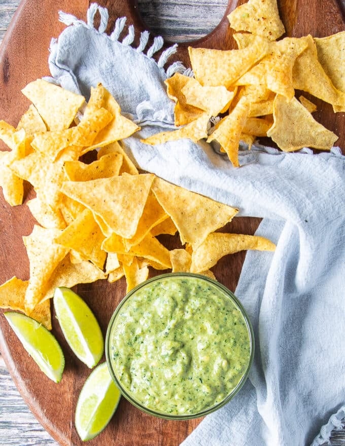Poblano Sauce in a bowl on a board with chips