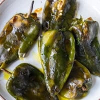 close up of roasted poblano peppers blistered and smoky