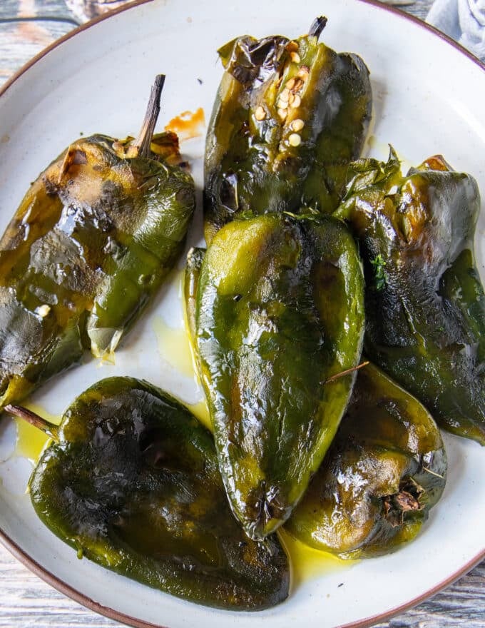 close up of roasted poblano peppers blistered and smoky