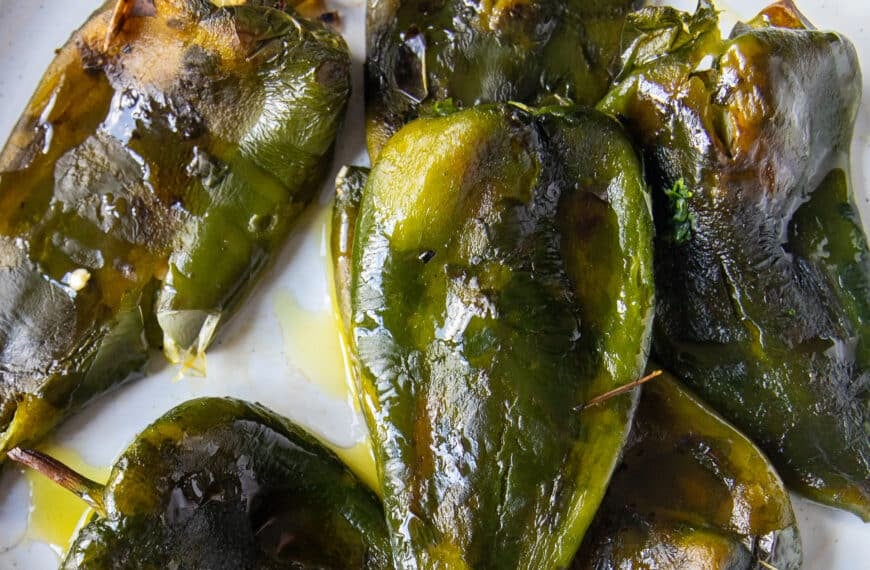 close up of roasted poblano peppers blistered and smoky