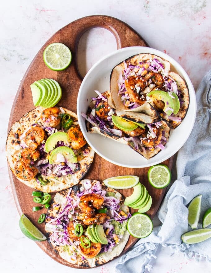 A board of shrimp tacos all assembled and ready to serve