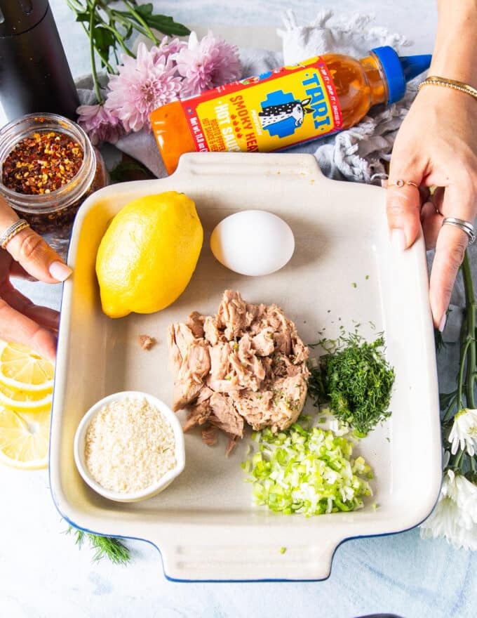 Ingredients to make tuna burger patty recipe on a board