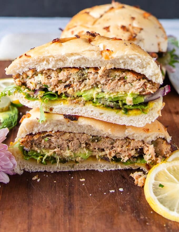 Cut up tuna burger in half showing the texture and details of the tuna burger patty recipe and toppings