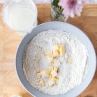 Cold butter pieces added to the flour mixture bowl