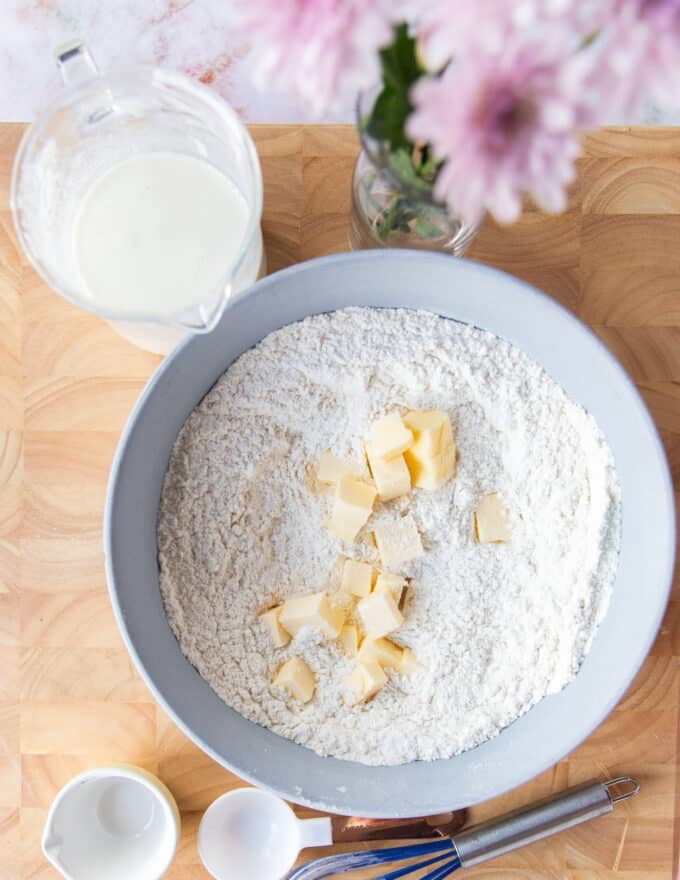 Cold butter pieces added to the flour mixture bowl
